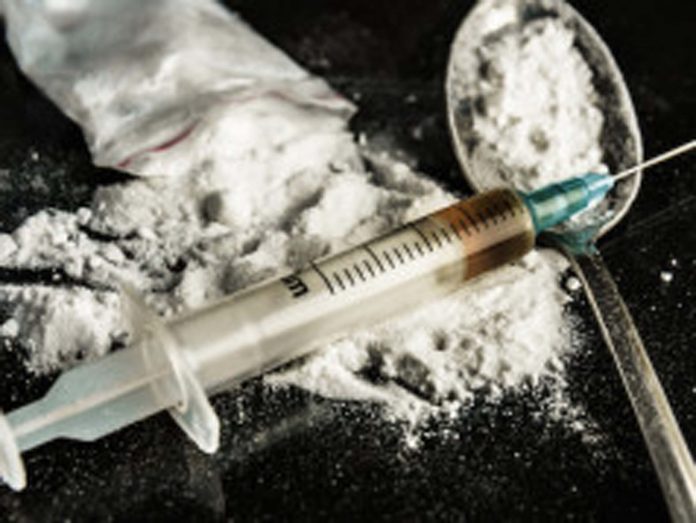 bigstock Drug Syringe And Cooked Heroin 76081889 238x179 1